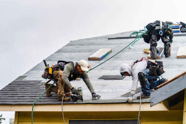 Professional Gutter Installation technician working in Reading, MA
